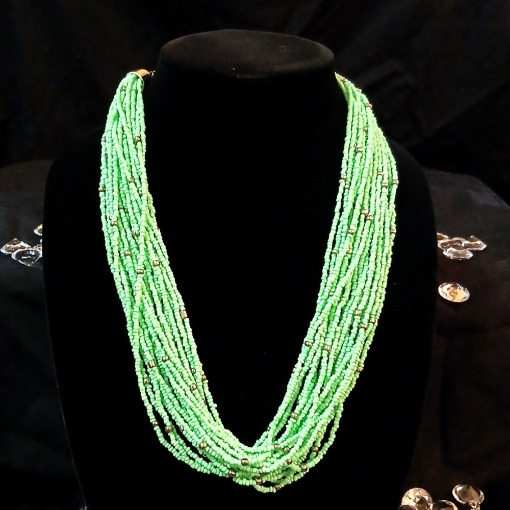 Multi strand bead necklace. 12 inches length. Pale green with silver beads